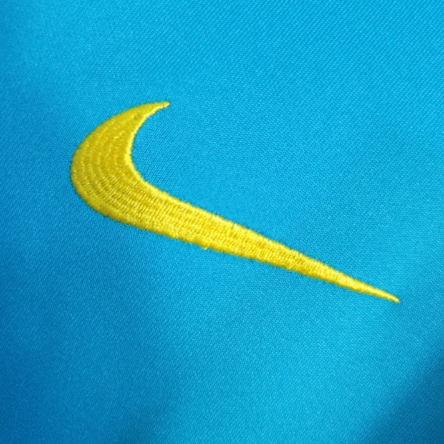 Jaqueta Corta-Vento Brasil 22/23 Masculino Nike - Azul com detalhes em amarelo