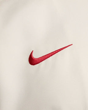 Jaqueta Corta-Vento Liverpool I 24/25 - Masculina Nike - Bege com detalhes em vermelho e preto
