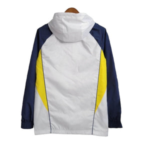 Jaqueta Corta-Vento Real Madrid 23/24 - Masculina Adidas - Branca com detalhes em azul e amarelo